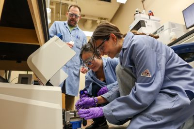 (From left) Josh Worch, Meng Jiang, and Emily Bird in lab together