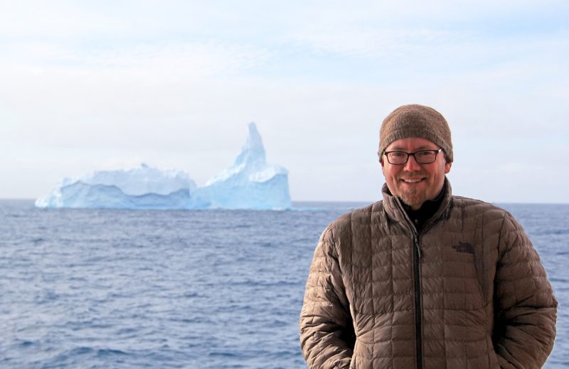Brian Romans poses with iceberg