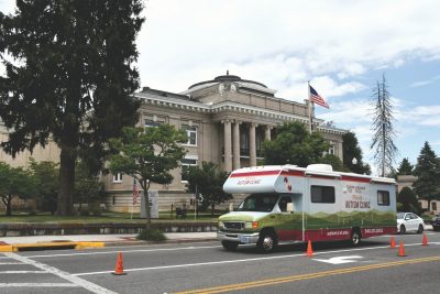 Mobile Autism Clinic RV drives past the courthouse in Marion, VA