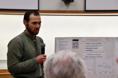 Student with microphone in classroom.