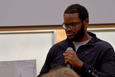 Student with microphone in classroom.