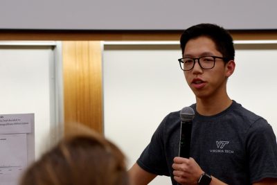 Student with microphone in classroom.