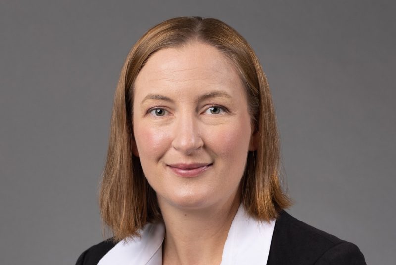 portrait of woman in black and white suit