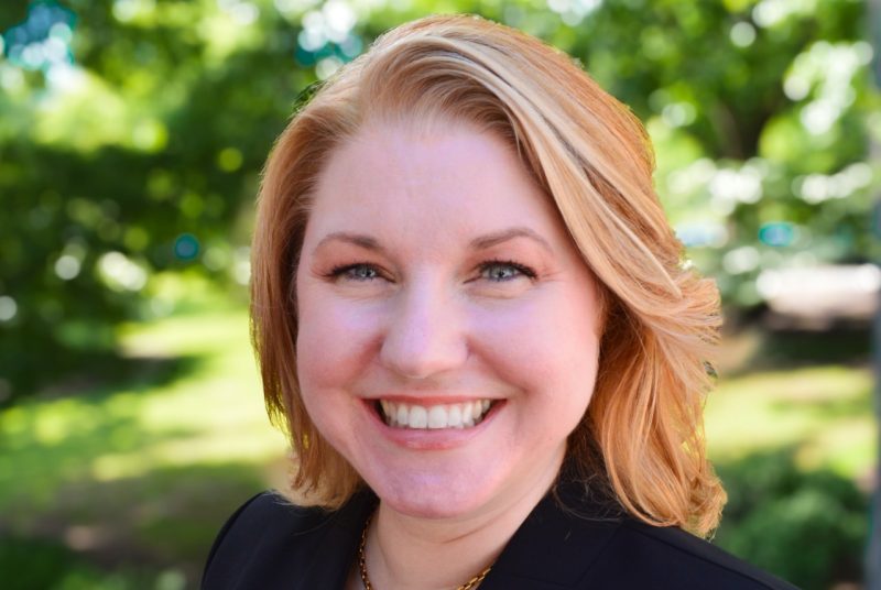 outside portrait of woman in black suit
