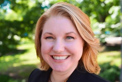 outside portrait of woman in black suit
