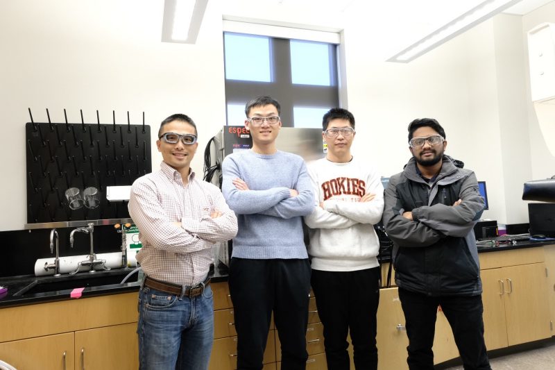 Lin lab group photo in chemistry lab