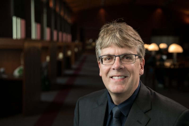 Chemistry Professor Tim long headshot with Torgersen Bridge interior backdrop