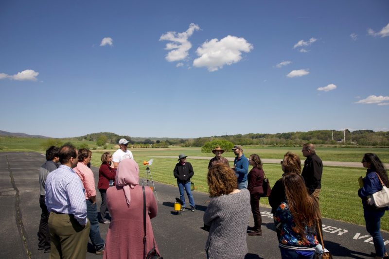 Participants of the Agricultural Cyber Field Day at Virginia Tech interact at a demonstration held at the drone airstrip at the Kentland Experimental Aerial Systems Laboratory.