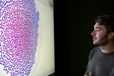 student looks at data heat map in cmda lab