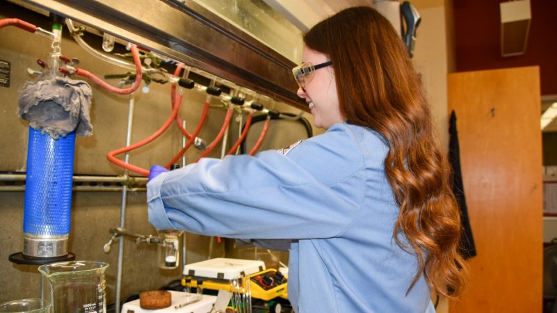female scientist sets up chemical titration