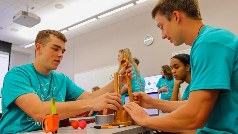 students clear catapults in summer camp