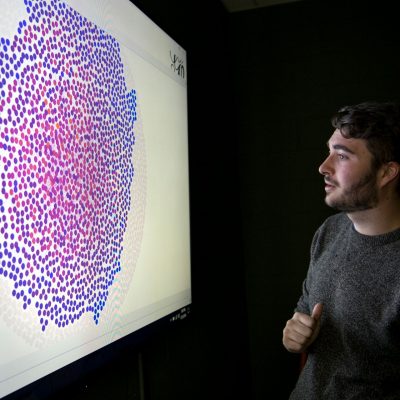 student looks at data heat map in cmda lab