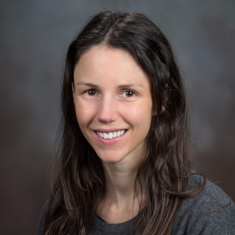 Sophia portrait with gray shirt and dark gray background