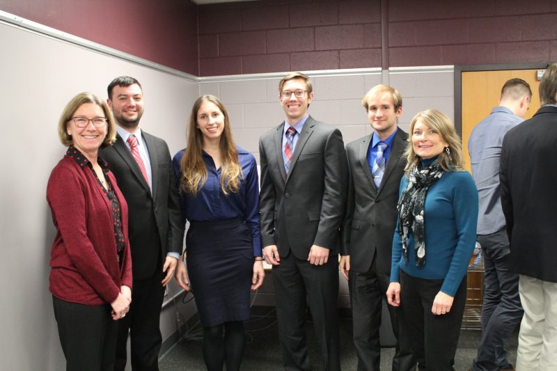 Dasha and CMDA students and sponsors pose for photo