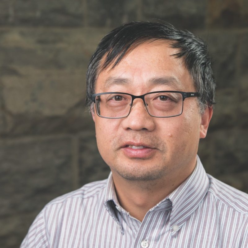 Shuhai Xiao Xiao portrait in front of Hokie Stone wall