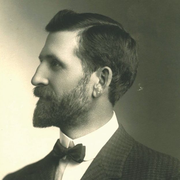 black and white side view portrait of man circa early 1900s